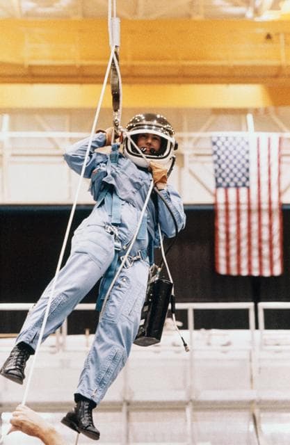NASA image: Christa McAuliffe using Sky-genie during emergency egress training
