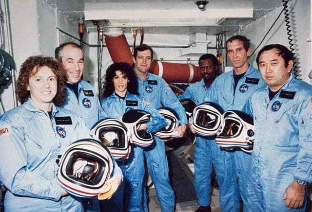 NASA image: Crew pose for portrait while training at KSC