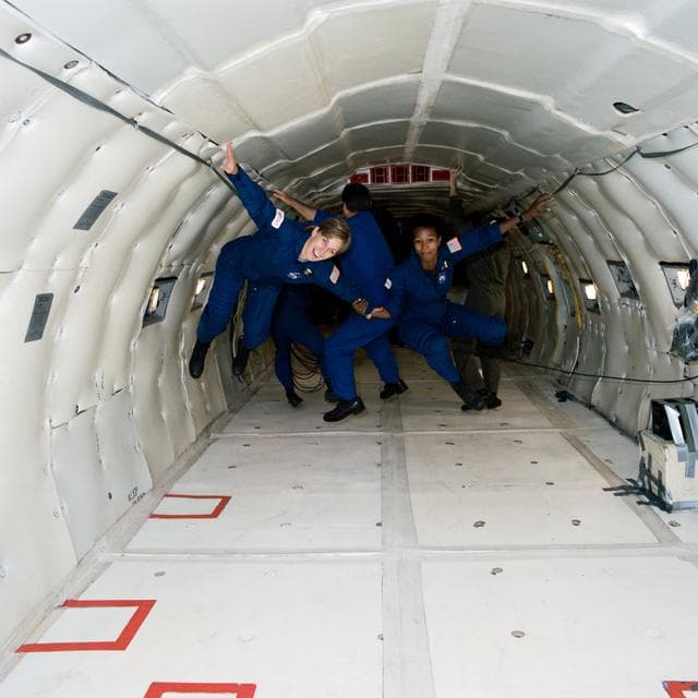 NASA image: Group 12 ASCANs Davis and Jemison during zero gravity training aboard KC-135