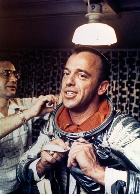 NASA image: Astronaut Alan Shepard removing space suit on U.S. Champlain after recovery