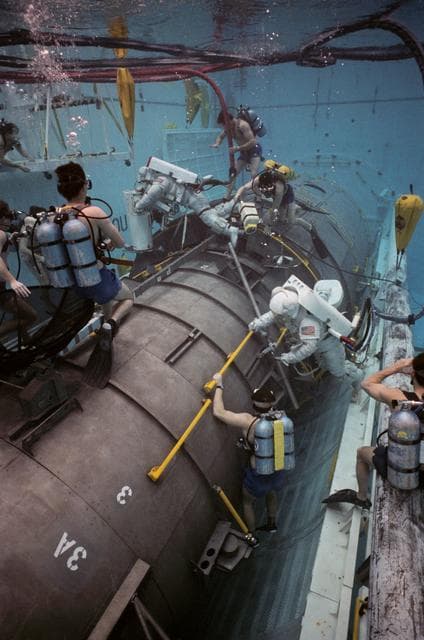 NASA image: STS-31 MS McCandless and MS Sullivan during JSC WETF underwater simulation