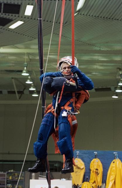 NASA image: Cosmonaut Yuriy Onufriyenko simulates parachute drop into water