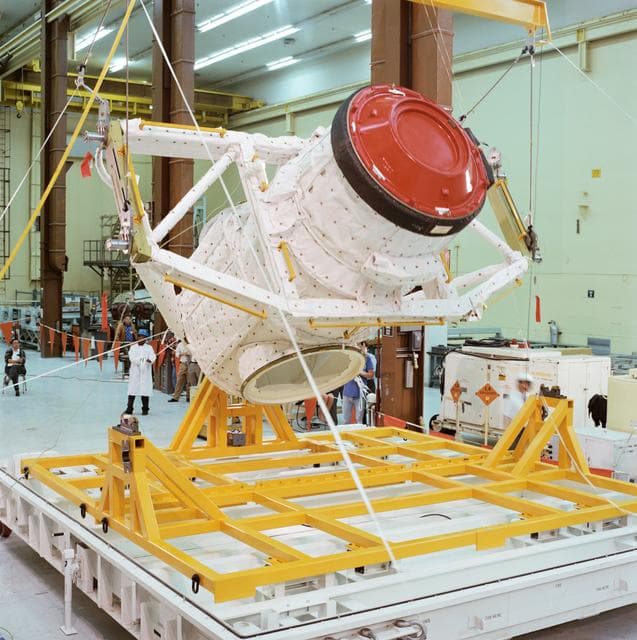 NASA image: External airlock assembly/Mir docking system being loaded