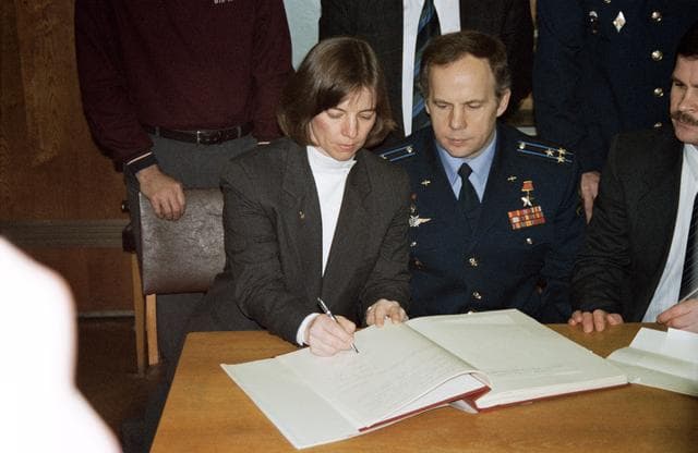NASA image: Astronauts & cosmonauts sign Gagarin's diary