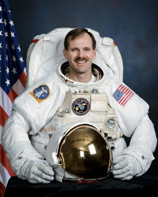 NASA image: Official portrait of Astronaut Steve Smith wearing an EMU