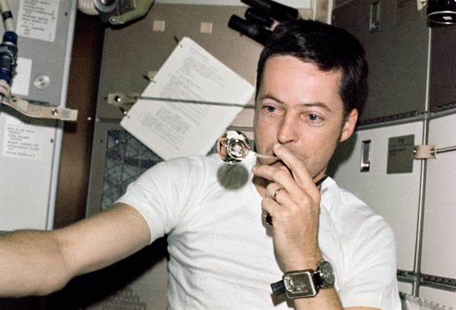 NASA image: Astronaut Joseph Kerwin forms perfect sphere with water droplet