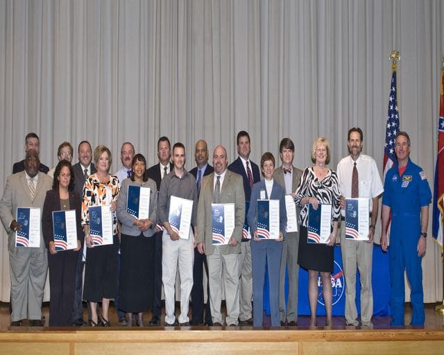 NASA image: Astronaut Robinson presents 2010 Silver Snoopy awards