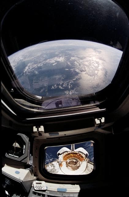 NASA image: View of the Discovery's payload bay during EVA taken from inside shuttle