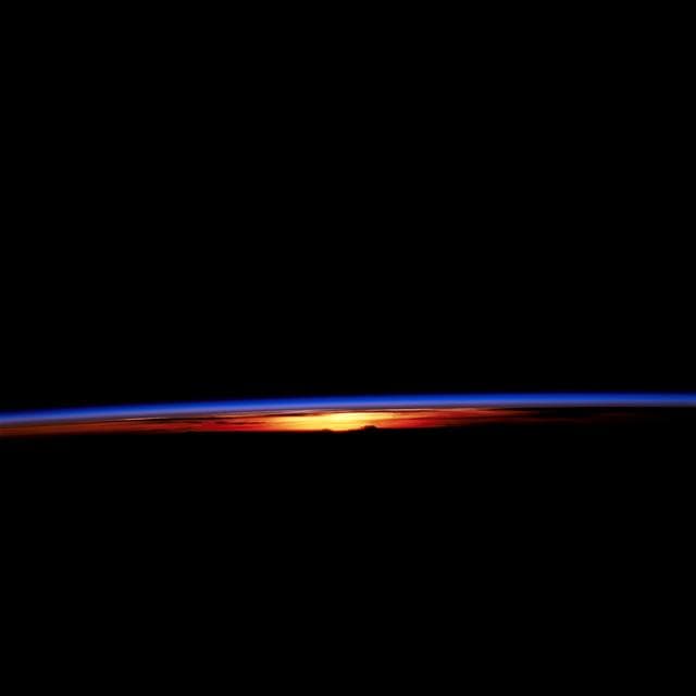 NASA image: STS-67 sunset and earth limb view