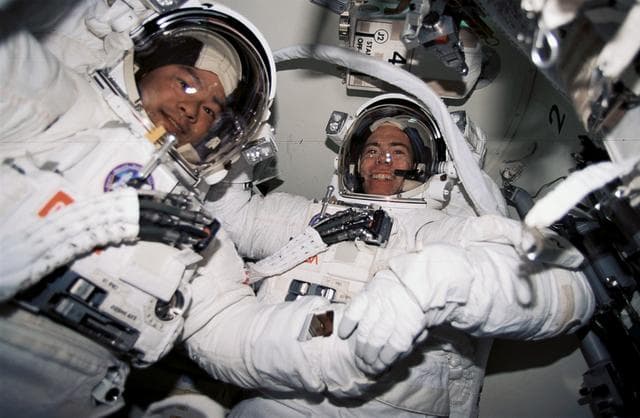 NASA image: EMU suited crewmembers prepare for first EVA of STS-72 mission