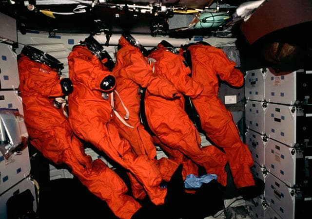 NASA image: Orange LESs lined up on middeck on re-entry day