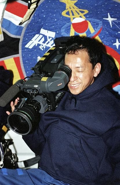 NASA image: STS-99 MS Mohri operates the HD camera on OV-105's middeck