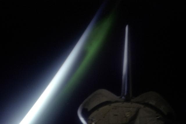 NASA image: Views of a sunrise and an aurora taken from OV-105 during STS-99