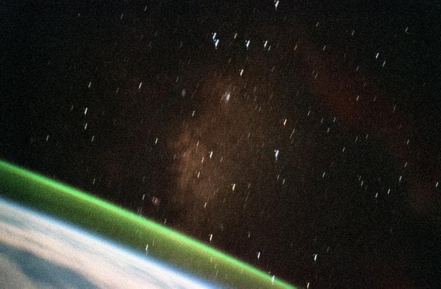 NASA image: Earth limb views with greenish bands of airglow during STS-99