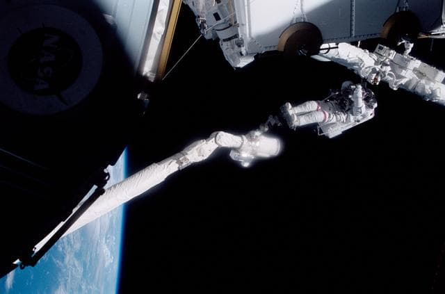 NASA image: MS Hadfield works on the SSRMS during the first EVA of STS-100