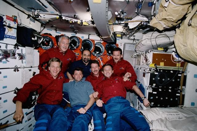NASA image: STS-100 crew poses for the inflight crew photo on the middeck of Endeavour during STS-100