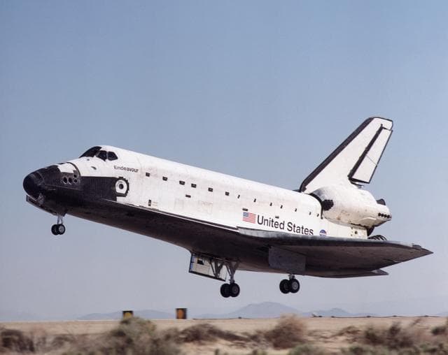 NASA image: Profile view of Endeavour prior to touching down at Edwards AFB during STS-100's landing