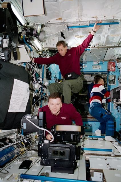 NASA image: Wetherbee 'surfs' on the back of Kelly in the U.S. Laboratory