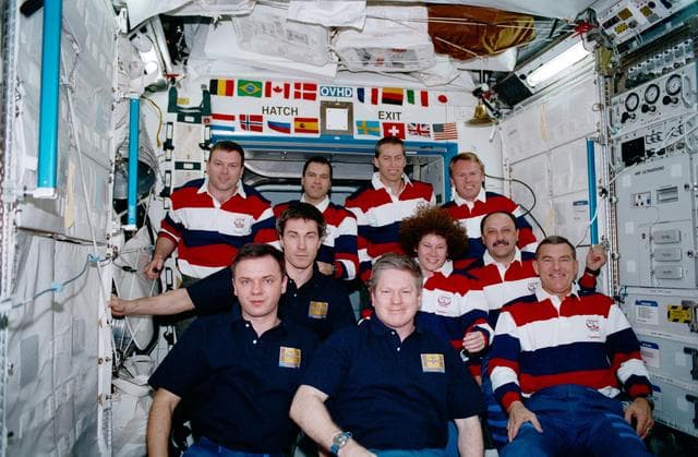 NASA image: STS-102, and Expeditions One and Two crewmembers pause for a portrait