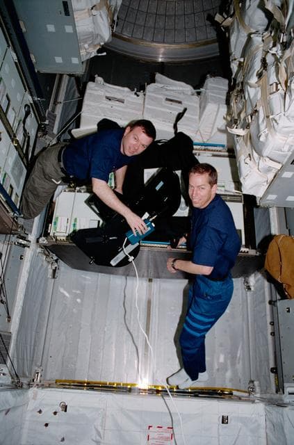 NASA image: Crew activity in the U.S. Laboratory; Wetherbee and Kelly in MPLM