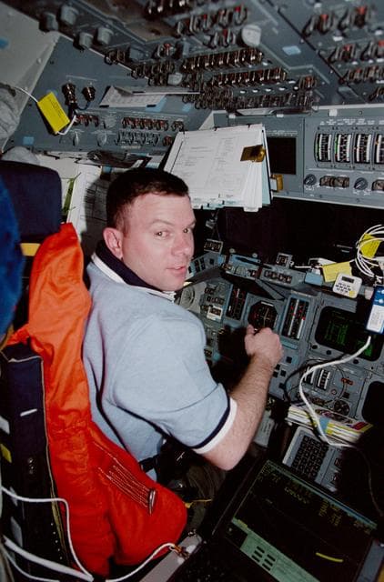 NASA image: Various crewmembers in the orbiter flight deck