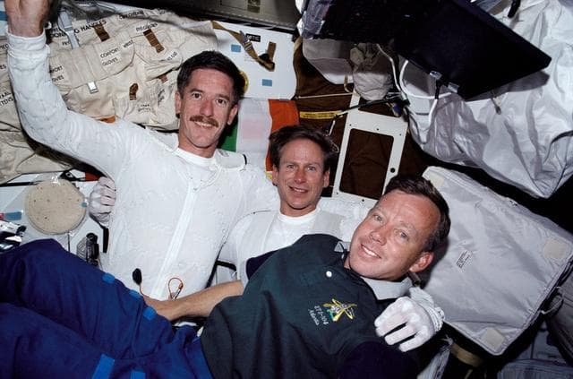 STS-104 MS Reilly and Gernhardt and CDR Lindsey on middeck prior to EVA 2