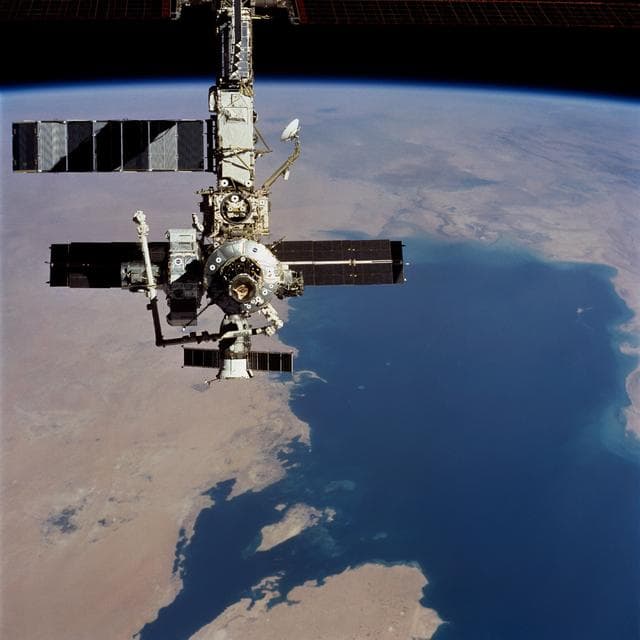 NASA image: Overall view of ISS taken during fly-around by STS-104 crew