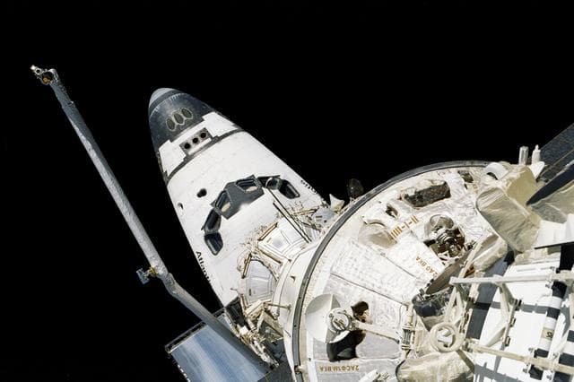 NASA image: Aft end of FGB/Zarya looking towards docked orbiter