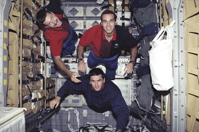NASA image: Mastracchio, Burbank and Malenchenko pose in SpaceHab during STS-106