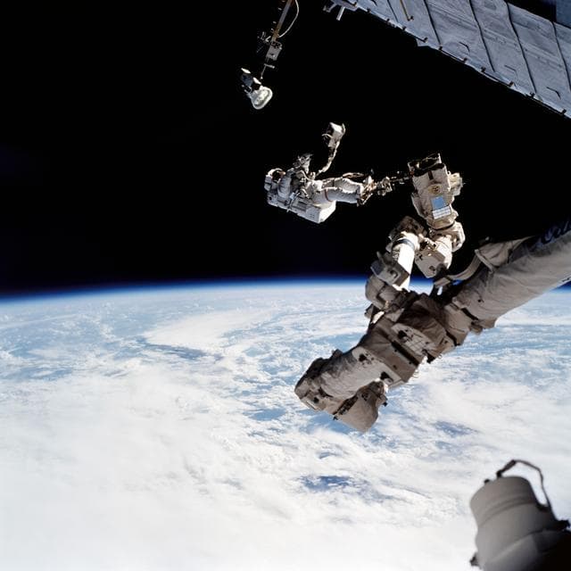 NASA image: EVA 2 - MS Wolf with EVA tool kit on SSRMS