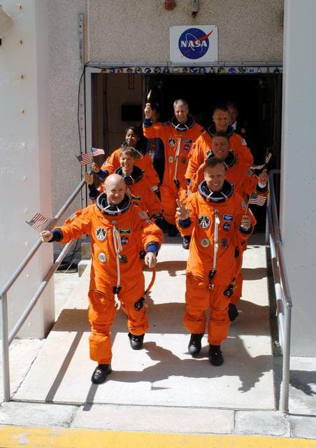 NASA image: STS-121 crewmembers leave the O&C Bldg. on their way to the launch pad