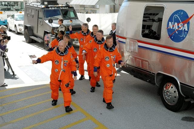 NASA image: STS-121 crewmembers prepare to board transfer van at KSC
