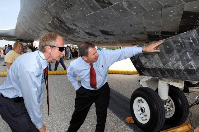NASA image: Griffen and Gerstenmaier inspect the orbiter Discovery after the STS-121 landing