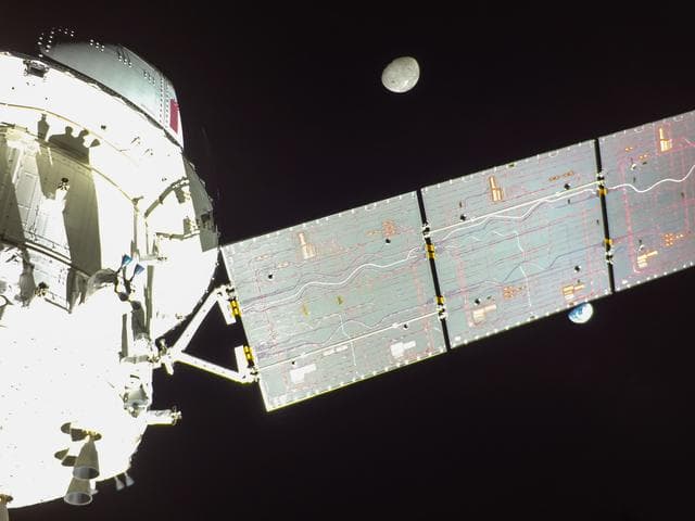 Flight Day 14: Orion's Solar Array Divides Earth and Moon