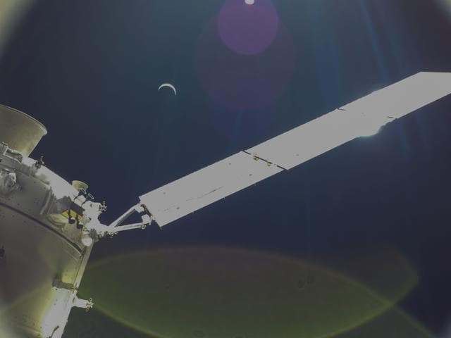 NASA image: Flight Day 22: Orion and Crescent Earth