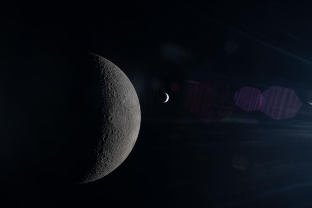 NASA image: Moon's Farside in the Foreground, Earth Beyond