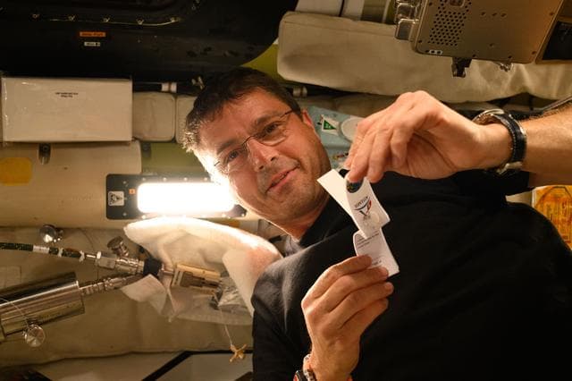 NASA image: Reid Wiseman Prepares to Collect Saliva Sample Aboard Orion