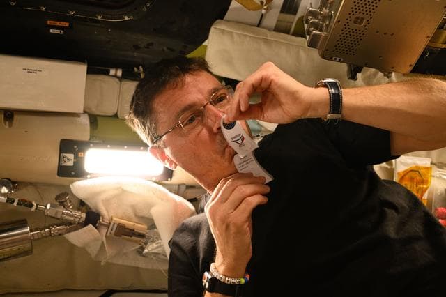 NASA image: Reid Wiseman Collects Saliva Sample Aboard Orion