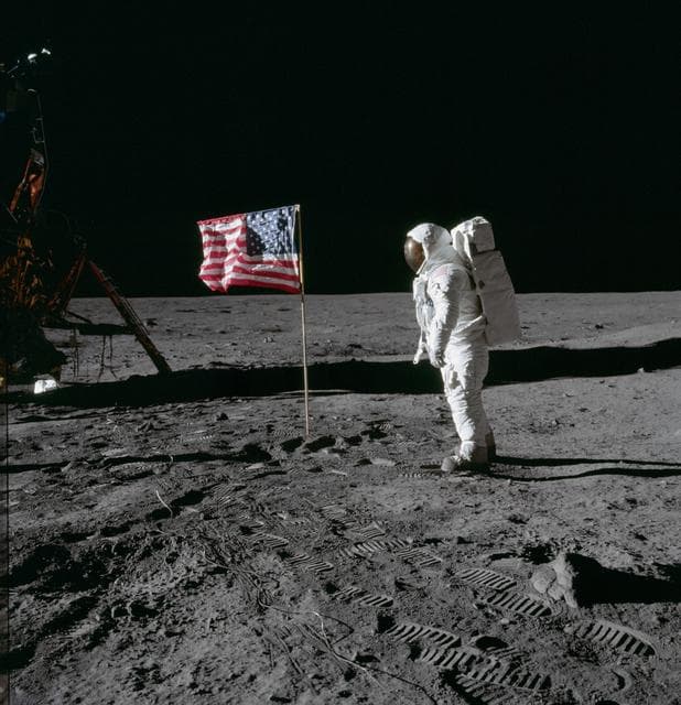 NASA image: Astronaut Edwin Aldrin poses for photograph beside deployed U.S. flag