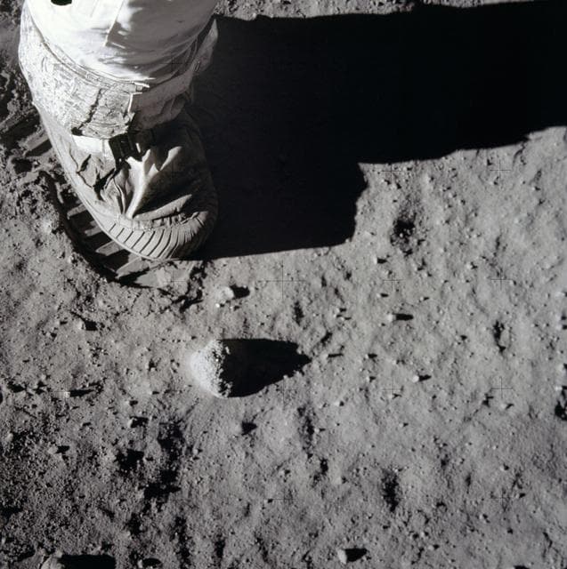 NASA image: Close-up view of astronauts foot and footprint in lunar soil