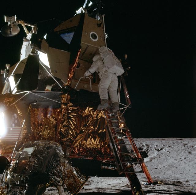 NASA image: Apollo 12 Mission image - Dark view of Astronaut Alan L. Bean climbing down the ladder of the Lunar Module (LM) 