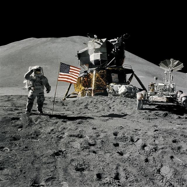 NASA image: Astronaut James Irwin gives salute beside U.S. flag during EVA