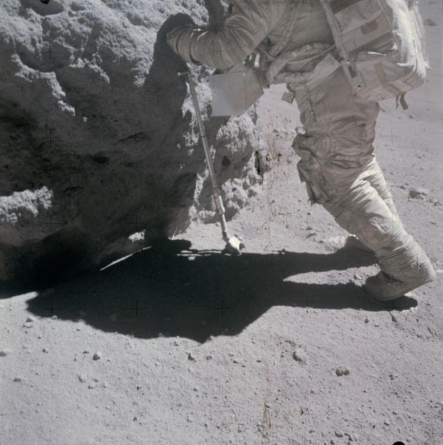 NASA image: Shadow of astronaut seen in front of rock being sampled