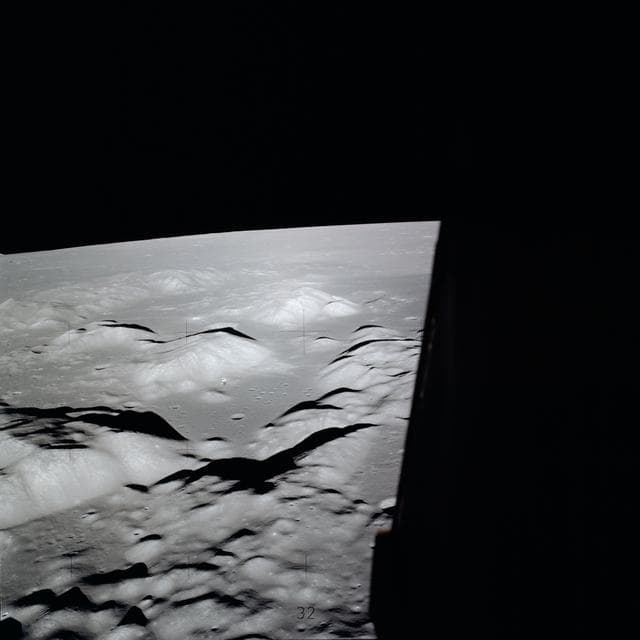 NASA image: Apollo 17 Command/Service Modules backdropped against lunar landing site