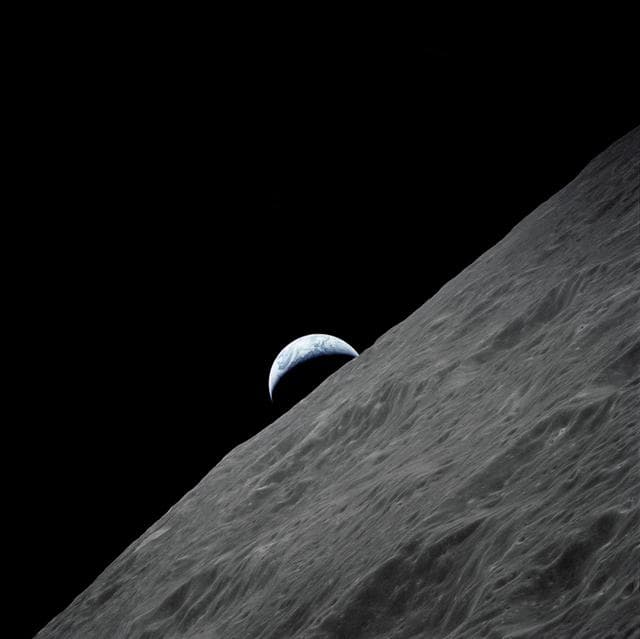 NASA image: Cresent Earth rises above lunar horizon