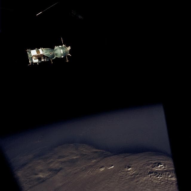 NASA image: Soviet Soyuz spacecraft contrasted against a black-sky background