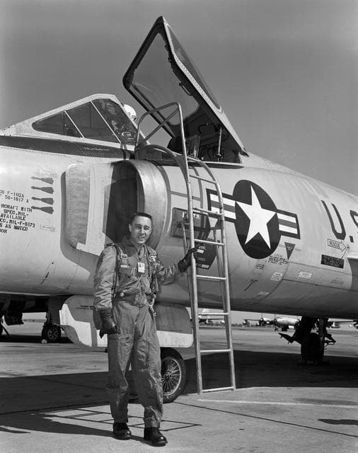 NASA image: Astronaut Virgil Grissom standing beside F-102 on the flight line