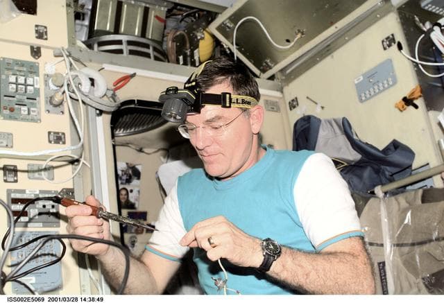 NASA image: Voss with soldering tool in Service Module