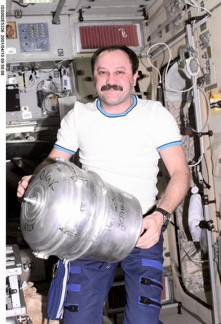 NASA image: Usachev with Solid Waste Container in Service Module