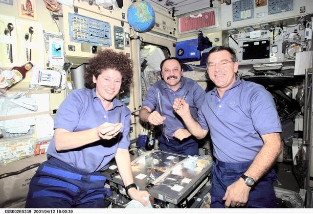 NASA image: Expedition Two crew eat a meal in the Service Module